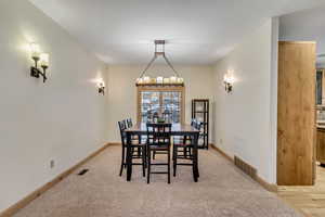 Dining room with light hardwood / wood-style floors