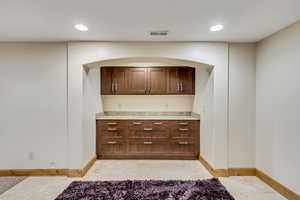 Bar featuring light tile patterned flooring