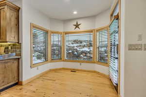 Dining area featuring light wood-type flooring