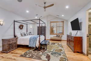 Bedroom featuring ceiling fan, light hardwood / wood-style flooring, and lofted ceiling