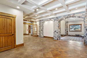 Interior space with beam ceiling and coffered ceiling