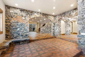 Hall featuring tile patterned floors