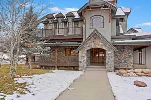 View of front of property with a balcony