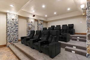 Home theater room featuring a tray ceiling