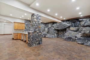 Kitchen with light brown cabinetry and sink