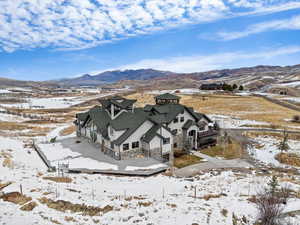 Snowy aerial view with a mountain view