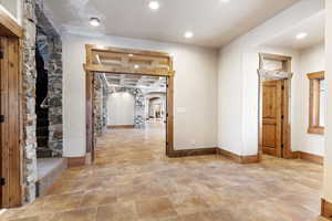 Hallway featuring beamed ceiling