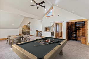 Game room featuring ceiling fan, high vaulted ceiling, light colored carpet, and billiards