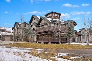 View of front of property with a balcony