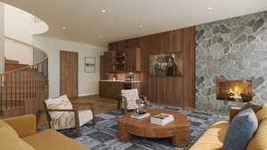 Living room featuring wood-type flooring, a fireplace, and wooden walls