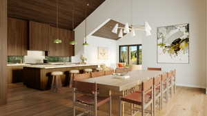 Dining room featuring sink, hardwood / wood-style flooring, high vaulted ceiling, and wood ceiling