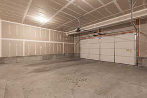 Garage featuring a garage door opener