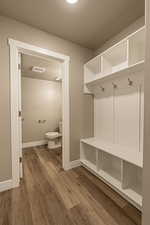 Mudroom featuring wood-type flooring and a textured ceiling