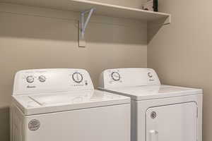 Laundry area featuring washing machine and clothes dryer