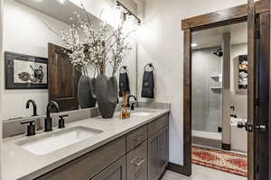 Bathroom with vanity and tile patterned floors