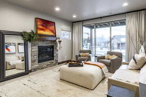 Living room with a stone fireplace