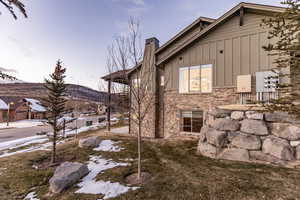 View of snow covered exterior featuring a mountain view