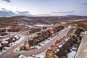 Snowy aerial view featuring a mountain view