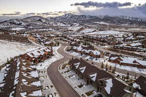 Snowy aerial view featuring a mountain view