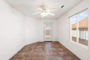 Spare room with ceiling fan