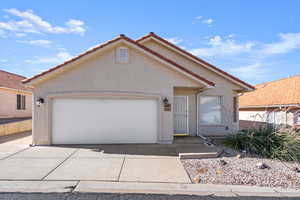 View of front of property featuring a garage