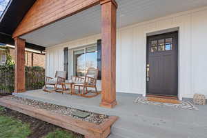 Doorway to property with covered porch