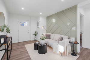 Living room with hardwood / wood-style flooring