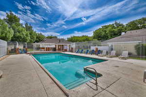 View of swimming pool with a patio area