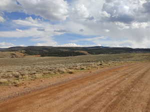 Property view of mountains with a rural view