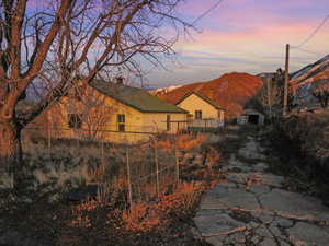 Yard at dusk with a mountain view