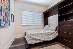 Bedroom featuring dark hardwood / wood-style floors