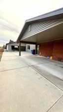 View of side of home featuring a carport