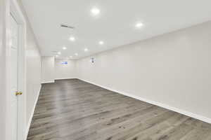 Basement featuring hardwood / wood-style flooring