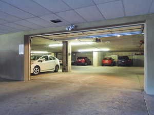 Garage featuring a garage door opener