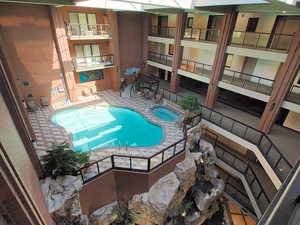 View of pool featuring an indoor hot tub and a patio