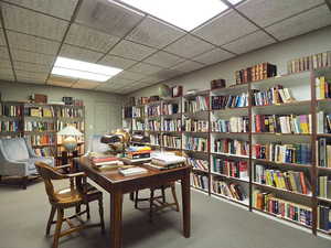 Carpeted office space featuring a paneled ceiling