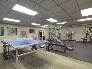 Exercise room featuring a drop ceiling