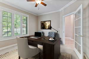 Office area with light carpet, french doors, ceiling fan, and crown molding