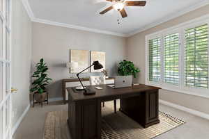 Office space featuring carpet flooring, ceiling fan, and crown molding