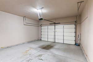 Garage featuring a garage door opener