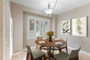 Dining room featuring light tile patterned flooring