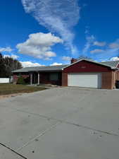 Ranch-style house featuring a garage