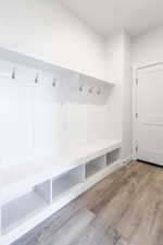 Mudroom with light hardwood / wood-style floors