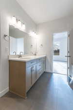 Bathroom featuring vanity and tile patterned floors