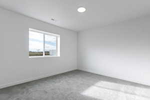 Unfurnished room featuring carpet flooring