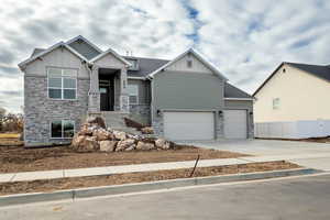 Craftsman house featuring a garage