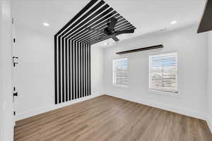 Unfurnished room featuring light hardwood / wood-style flooring and ceiling fan