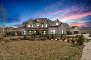 View of front of home with a lawn