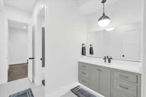 Bathroom featuring tile patterned floors and vanity