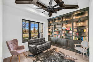 Living area featuring ceiling fan and light hardwood / wood-style floors